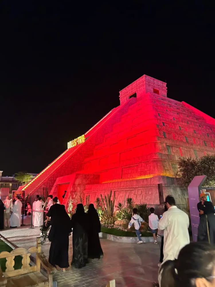 Boulevard Riyadh City lit up at night with themed zones and crowds