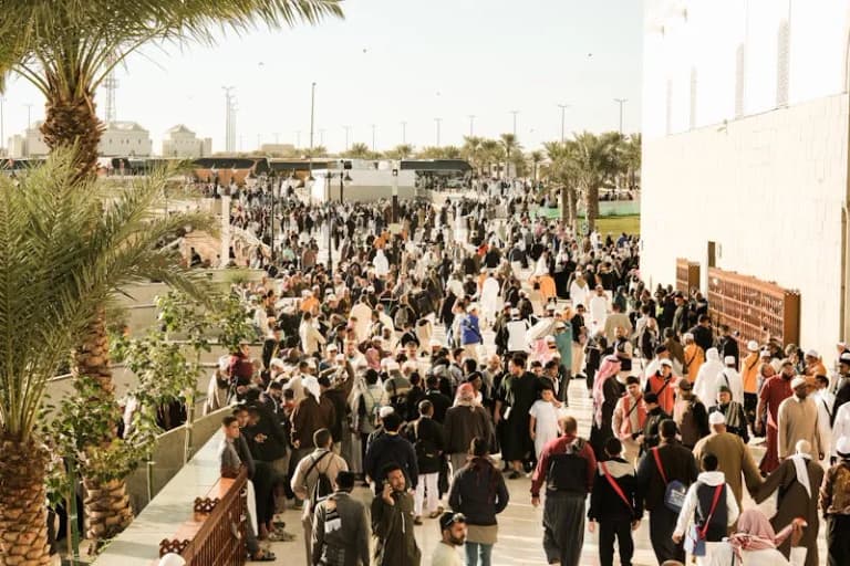 Diverse people gathered outdoors in Saudi Arabia