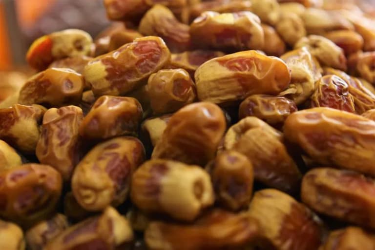 Fresh dates displayed at a market stall in Medina, Saudi Arabia
