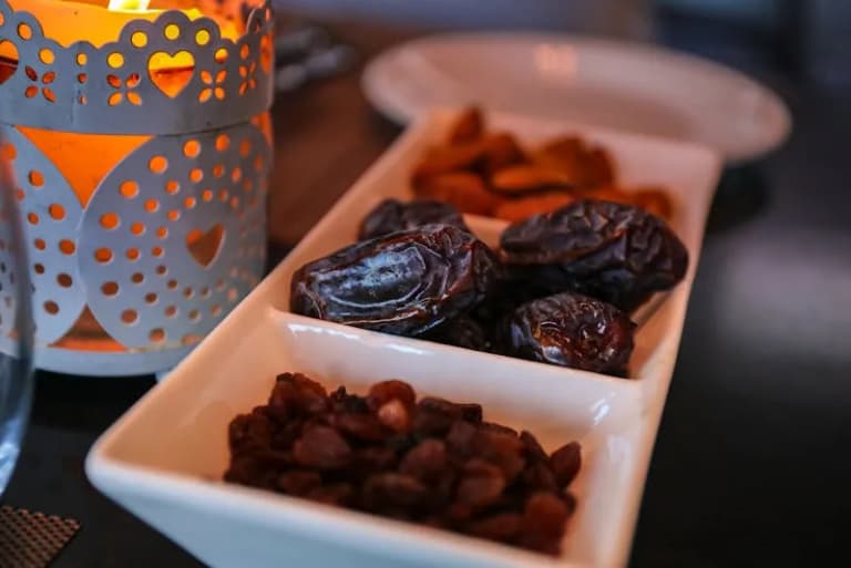 Traditional Ramadan lantern beside dried dates, symbolising the holy month