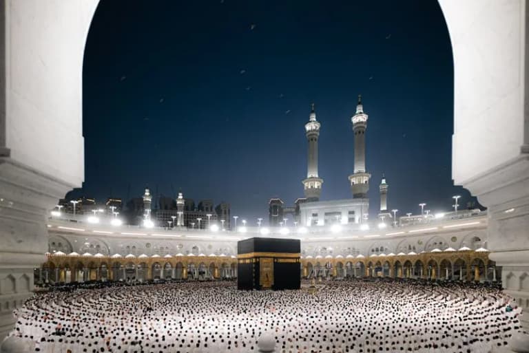 Night view of pilgrims at the Kaaba in Masjid al-Haram