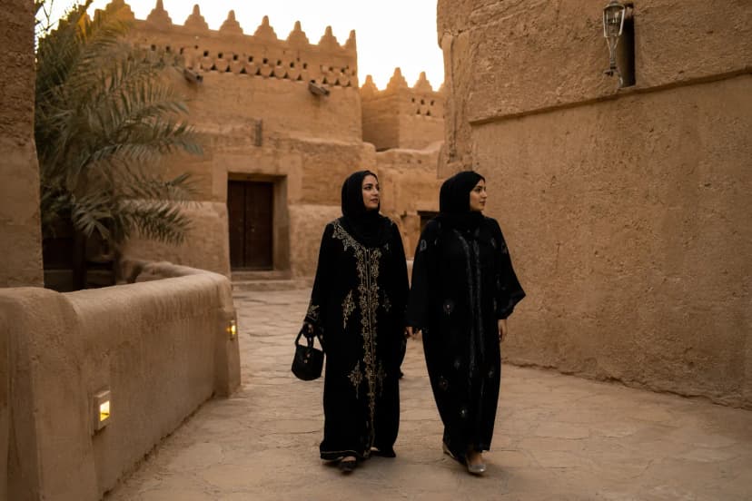 Woman walking through a historic district in Riyadh